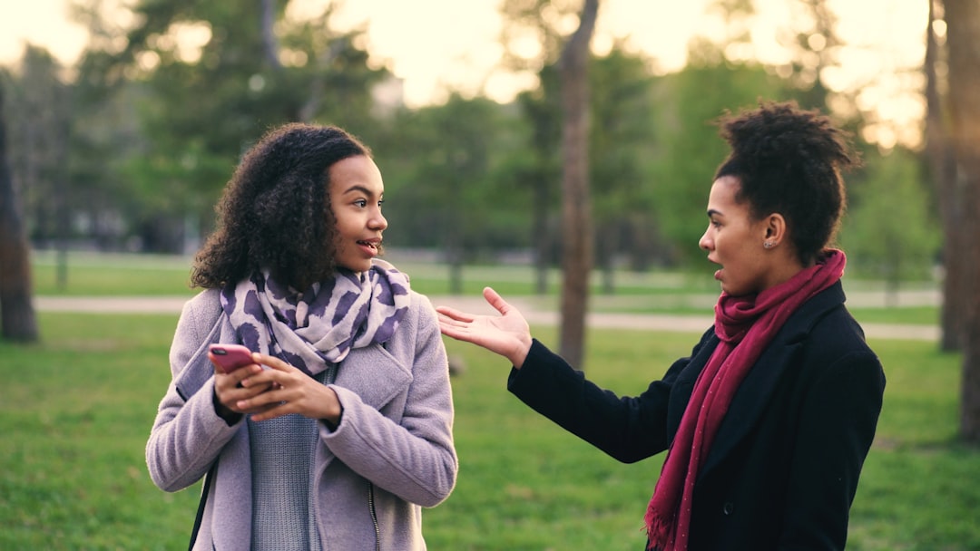 couple talking naturally relaxed park daytime