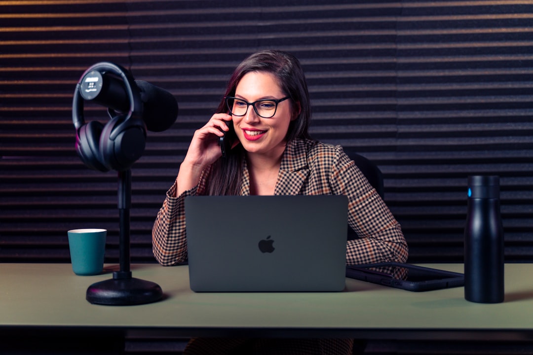 person speaking into phone microphone smiling