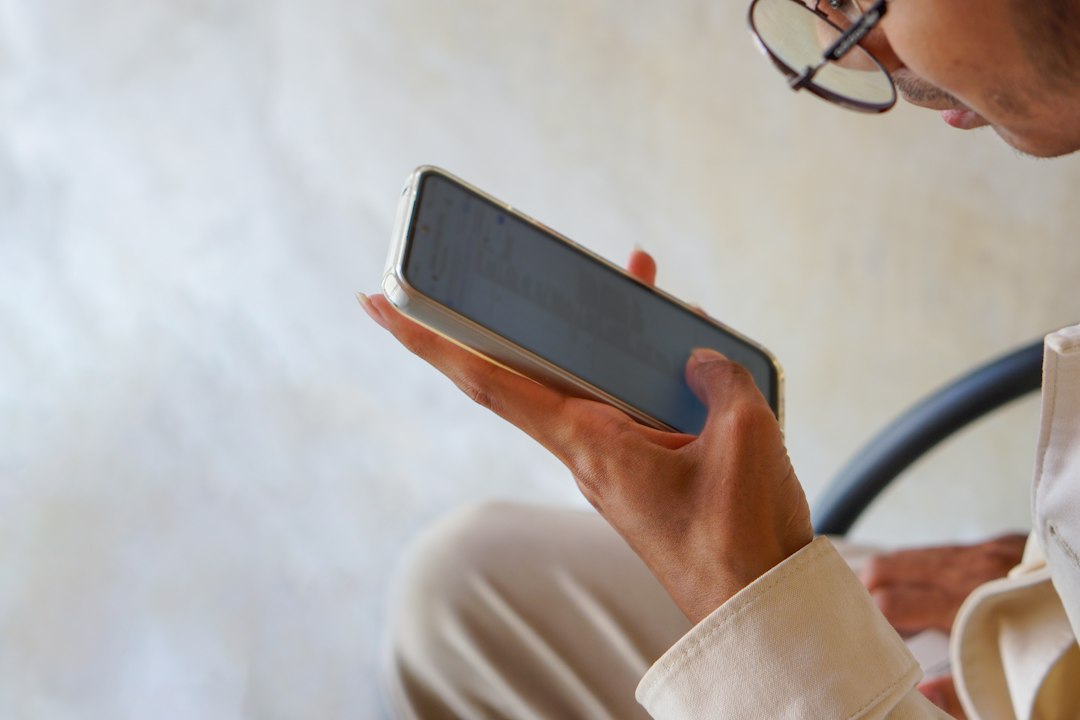 person reading profile smartphone caution