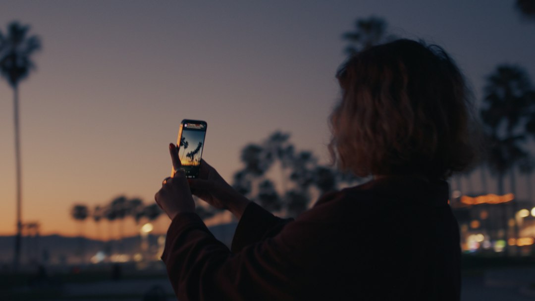woman texting messaging on smartphone evening