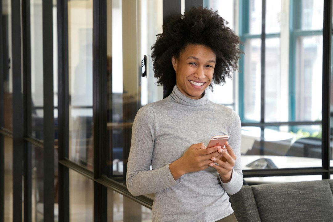 woman smiling phone message reply