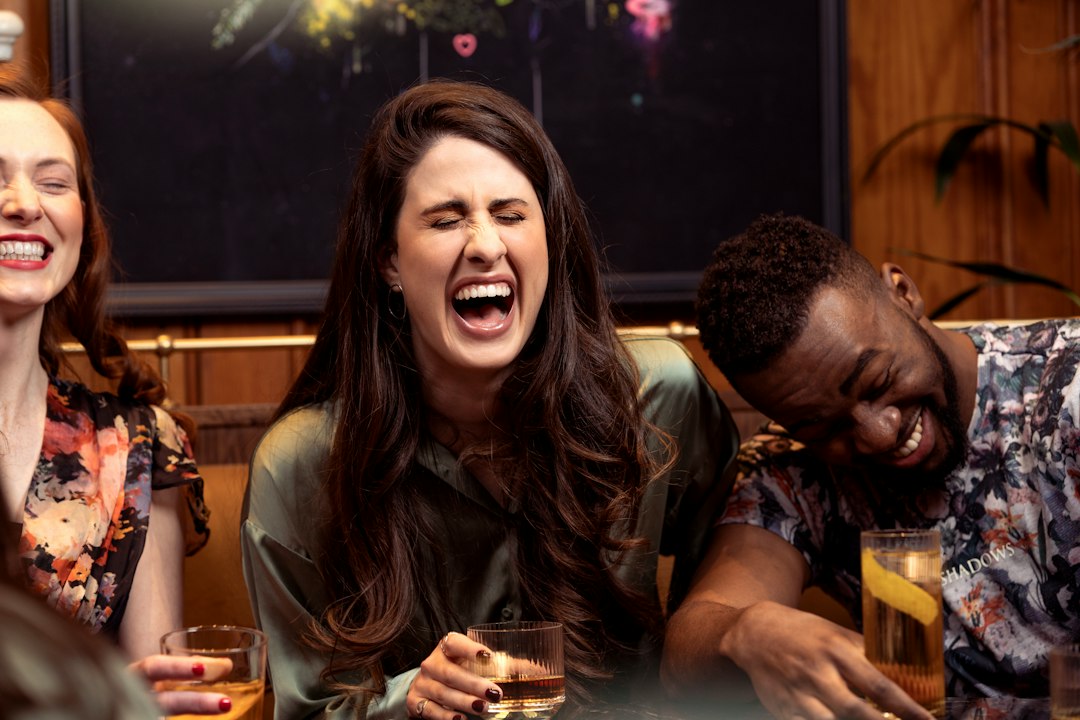man woman laughing restaurant date