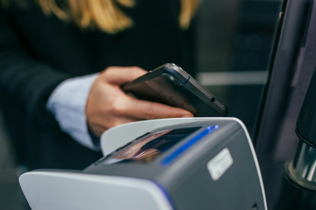 person scanning id card with smartphone