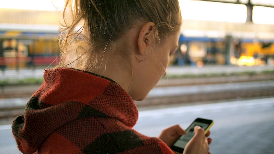 woman checking smartphone identity verification