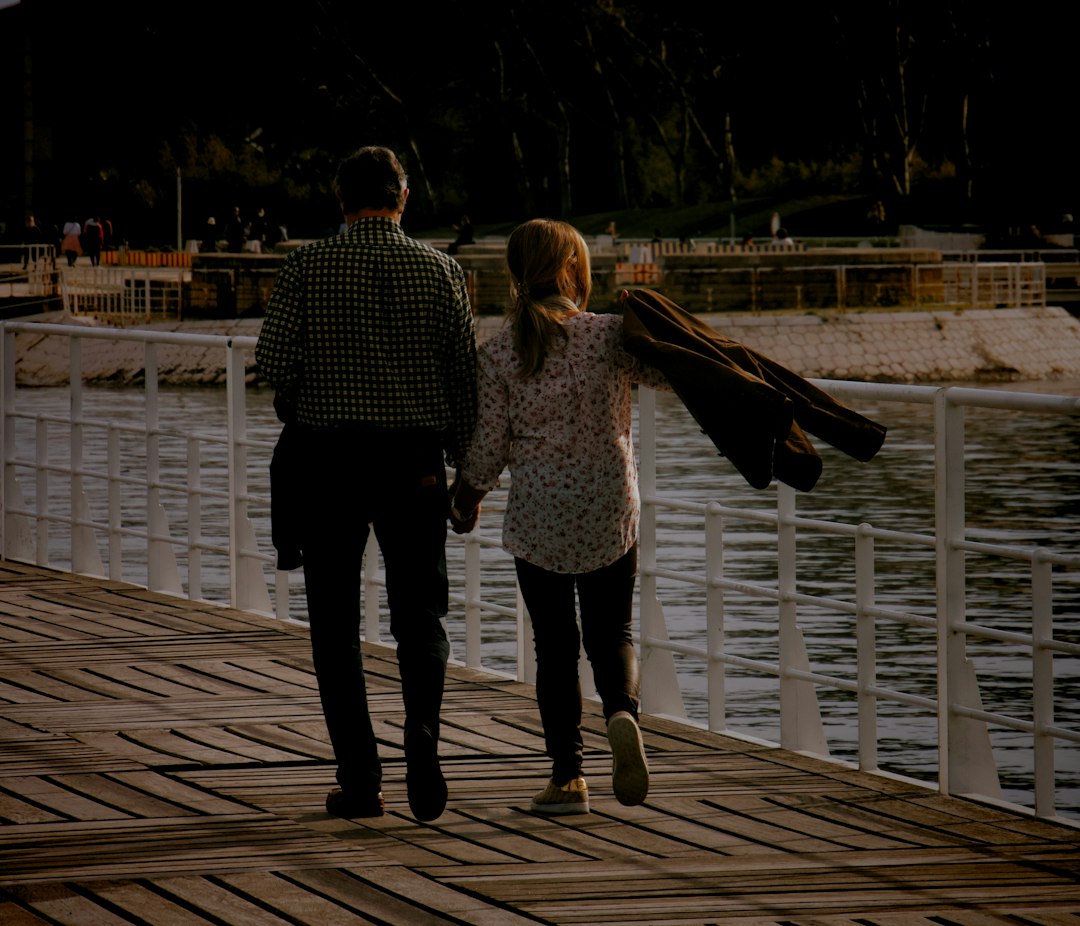 couple walking night date lights