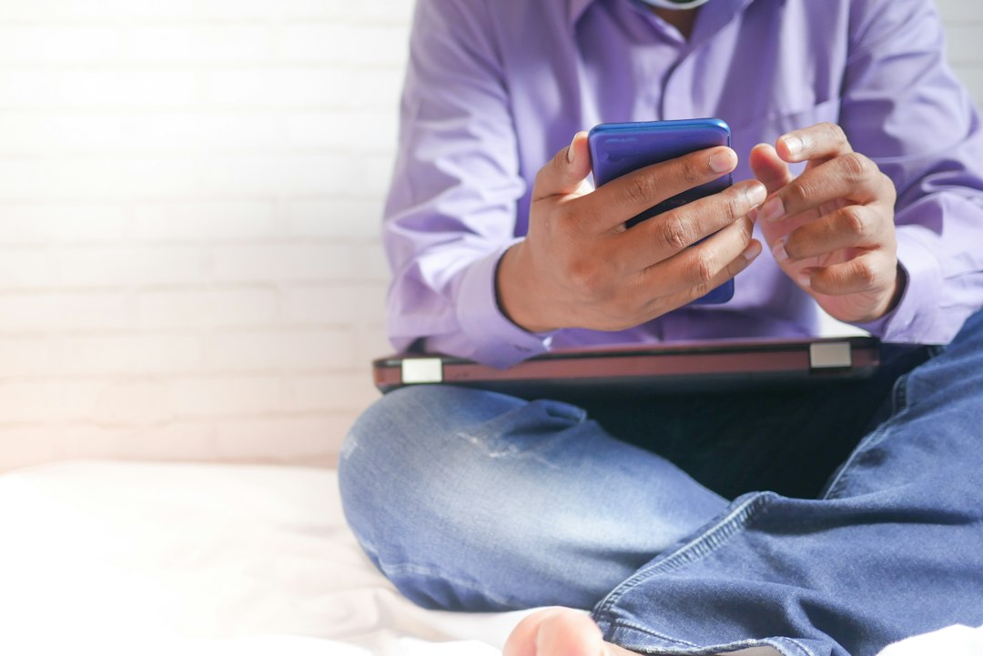 person thinking looking at phone